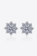 1 carat moissanite flower stud earrings in 925 sterling silver on white reflection surface.