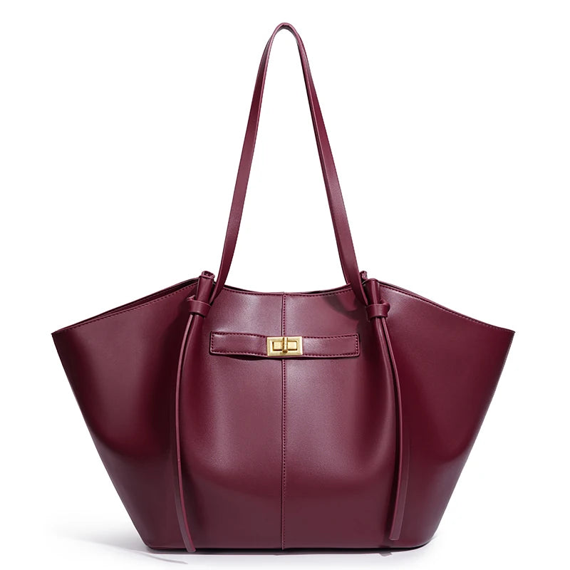 Brown bat-shaped vegan leather shoulder bag - lifestyle shot worn on the shoulder