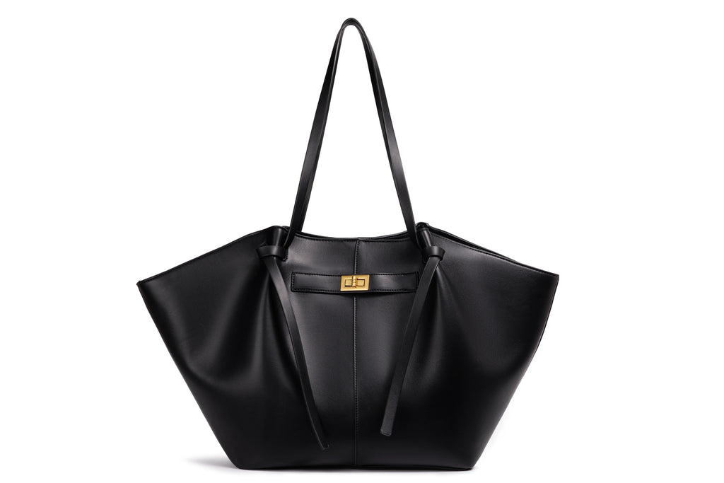 Black bat-shaped vegan leather shoulder bag - lifestyle shot worn crossbody