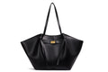 Black bat-shaped vegan leather shoulder bag - lifestyle shot worn crossbody