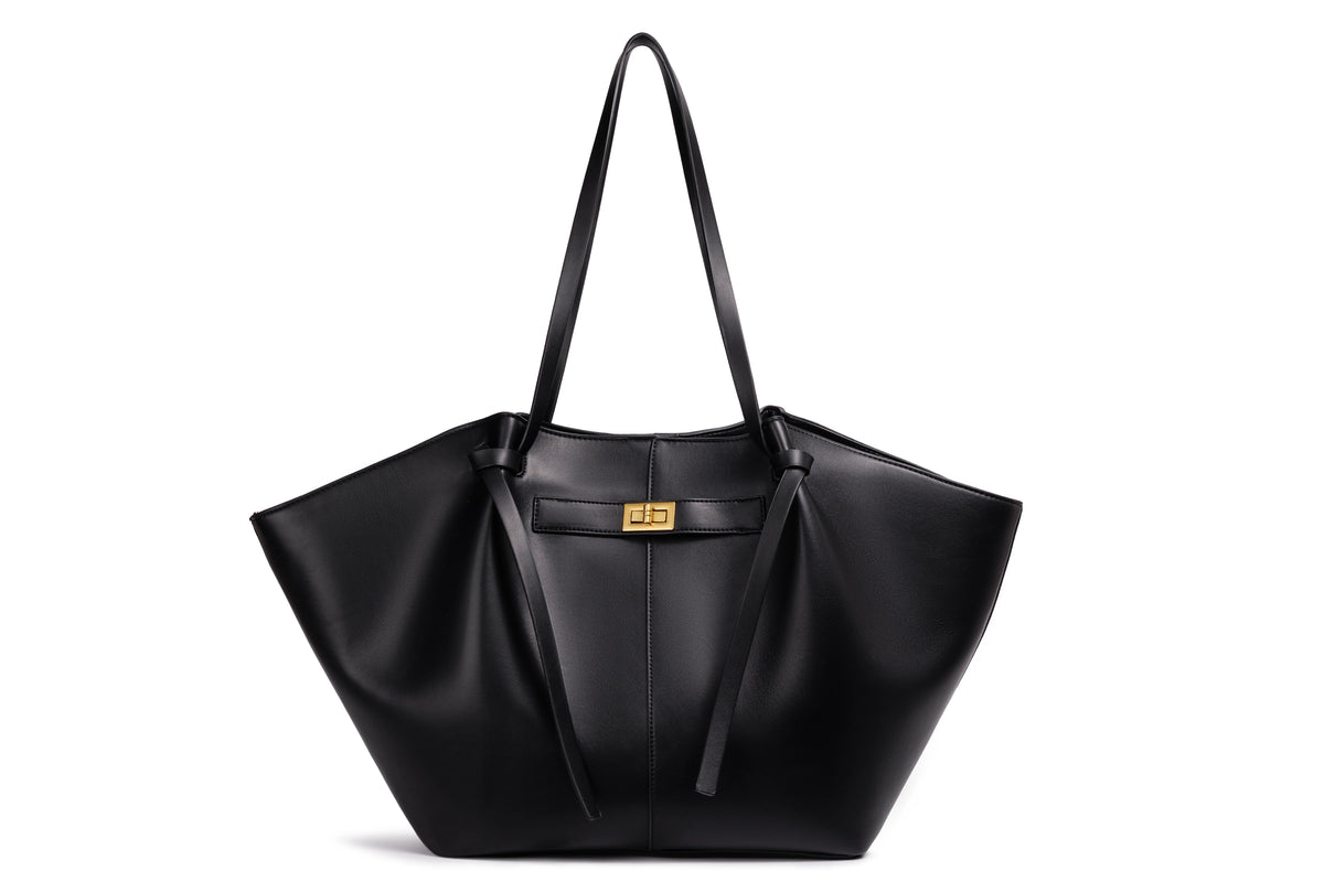 Black bat-shaped vegan leather shoulder bag - lifestyle shot worn crossbody
