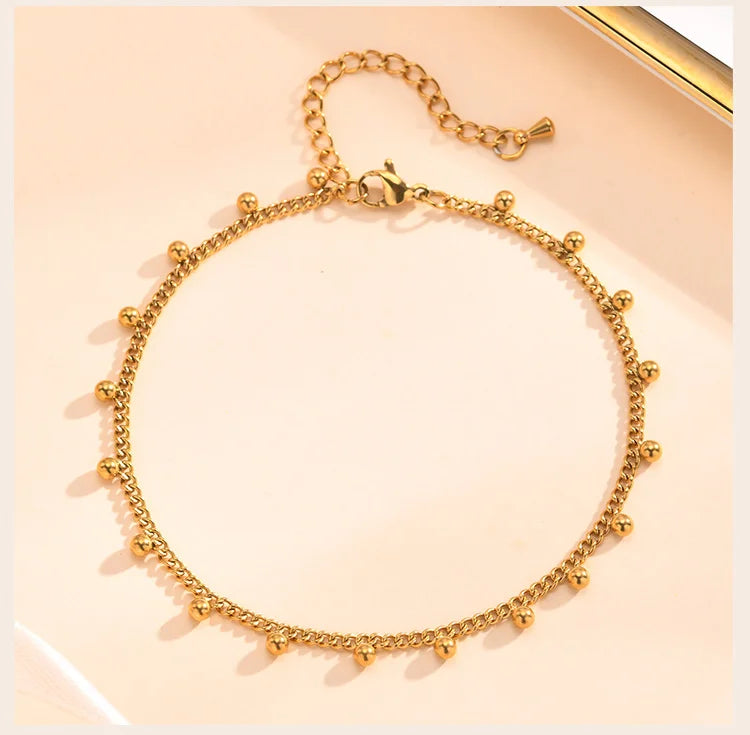 Beaded Cuban link anklet, styled beach lifestyle shot, Varex HQ