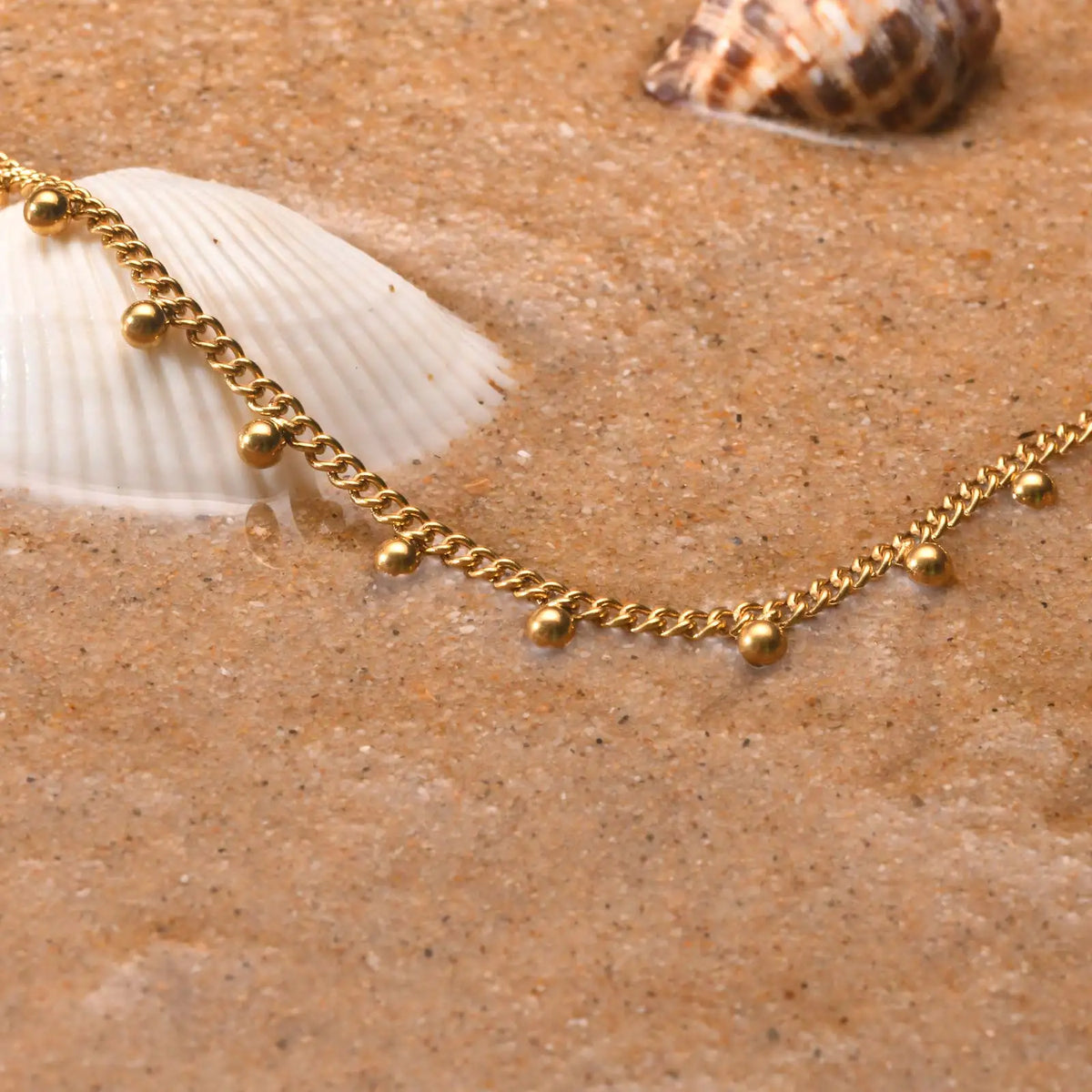 Beaded Cuban link anklet worn on model's ankle, Varex HQ