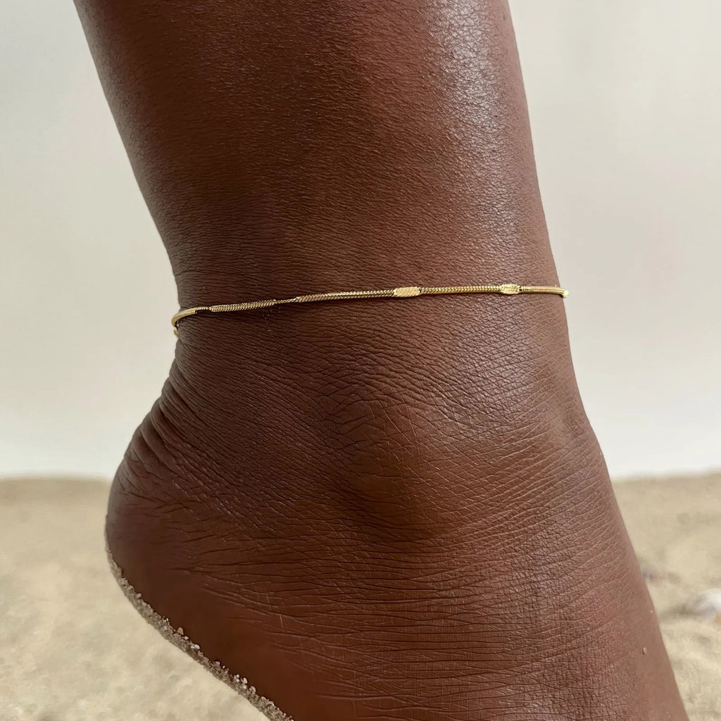 Beaded snake chain anklet worn on model's ankle, Varex HQ