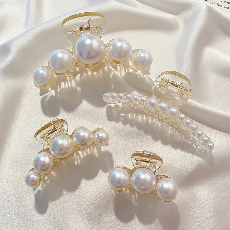 Big Pearl Hair Claw Clip in alloy with faux pearl accents, cross crab design, front view - Varex HQ