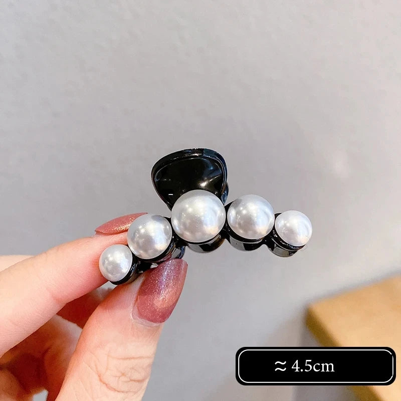 Big Pearl Hair Claw Clip in alloy with faux pearl accents, lifestyle shot - Varex HQ