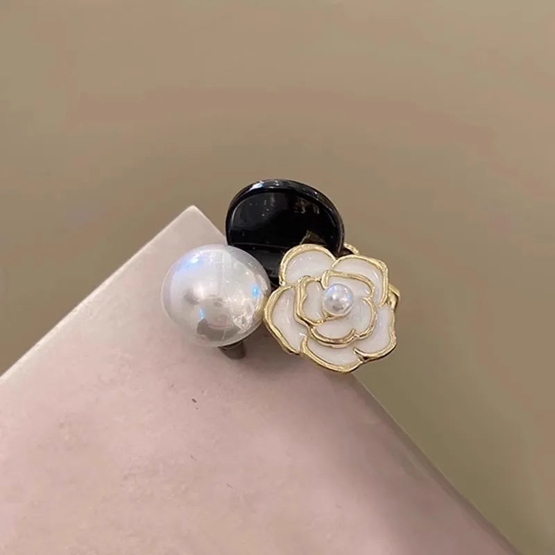Camellia Pearl Hair Claw Clip in acrylic with faux pearl accents, lifestyle shot - Varex HQ