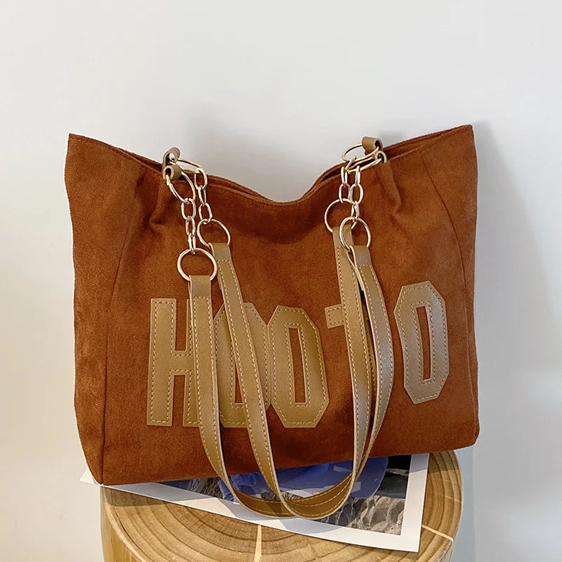 Black canvas campus tote bag - close-up of sturdy top handles