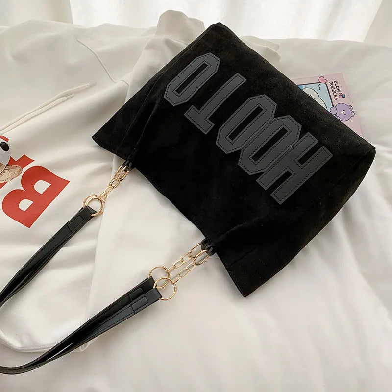 Canvas campus tote bag - lifestyle shot worn on the shoulder