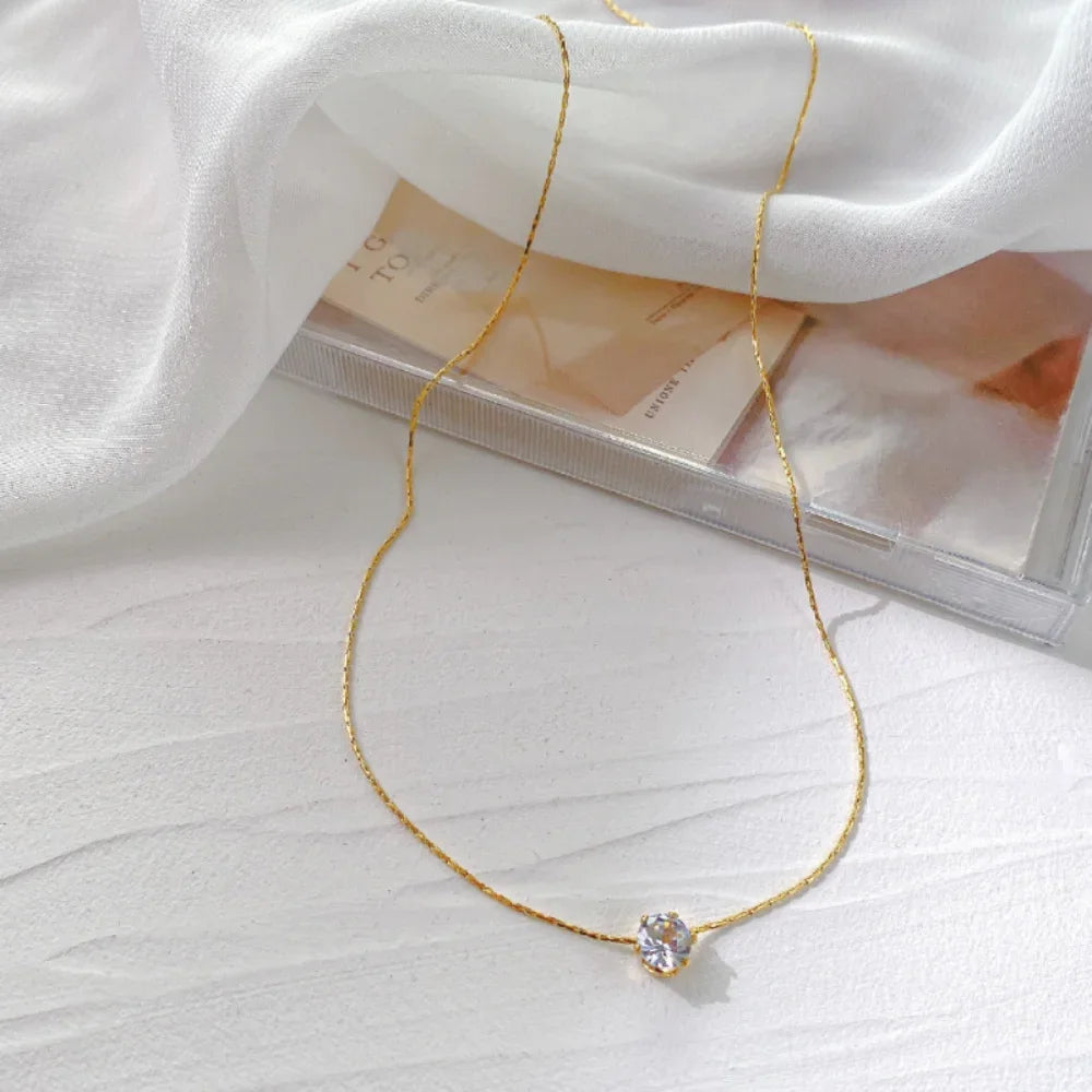 Dainty round cubic zirconia pendant necklace in gold-tone stainless steel - clasp and chain detail - Varex HQ