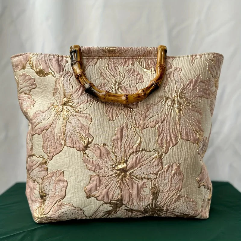 Pink embroidered canvas tote bag - front view showing double-sided embroidery detail