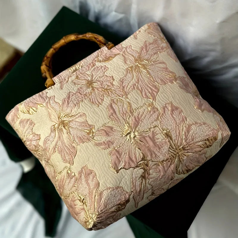 Pink embroidered canvas tote bag - close-up of sturdy top handles