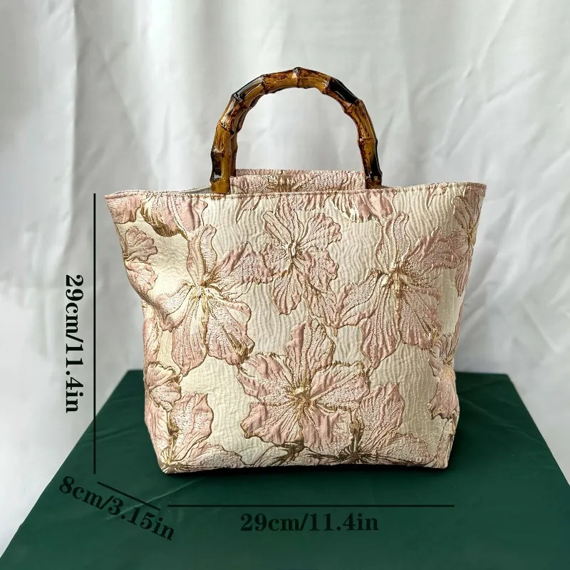 Pink embroidered canvas tote bag - side angle showing zip closure