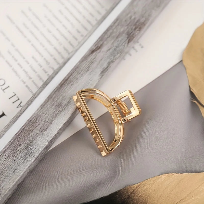 Geometric Hollow Hair Claw Clip in gold-tone metal finish, additional angle - Varex HQ