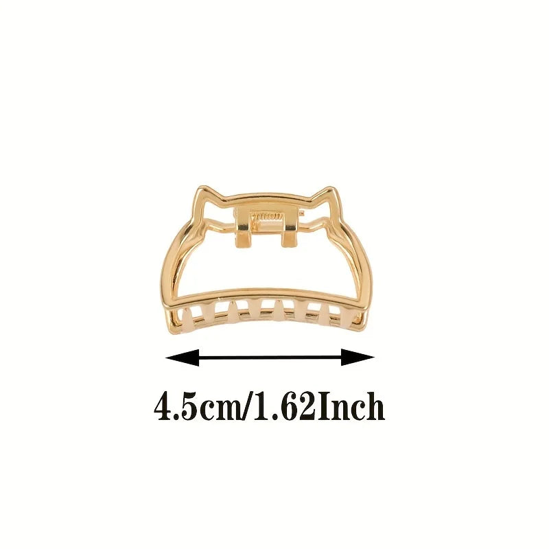 Geometric Hollow Hair Claw Clip in gold-tone metal finish, worn in hair - Varex HQ