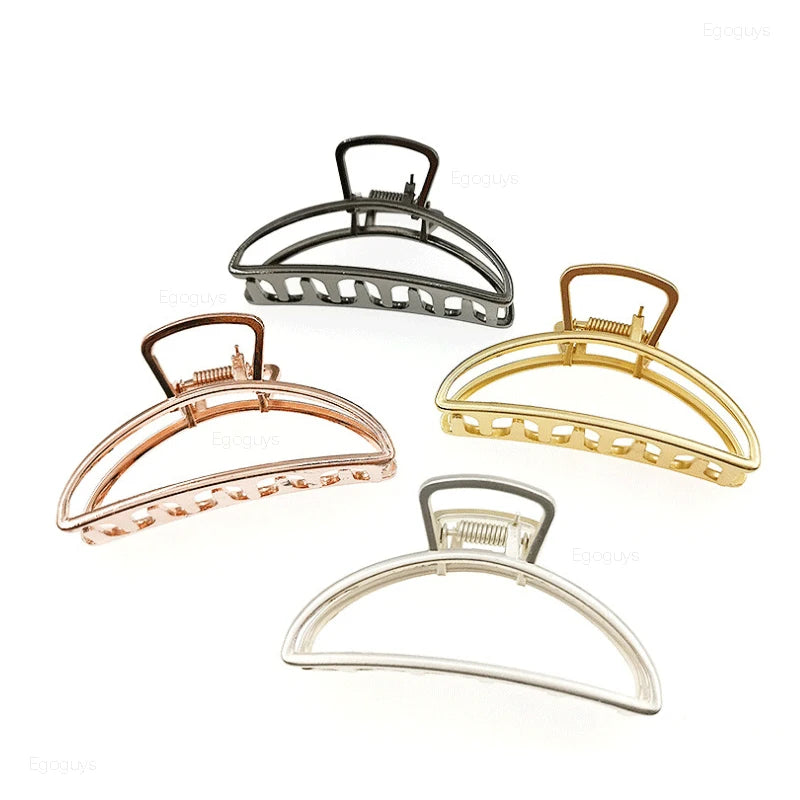 Geometric Metal Hair Claw Clip in silver, black and gold-tone metal finish, front view - Varex HQ