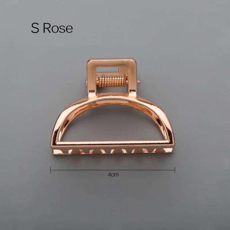 Geometric Metal Hair Claw Clip in silver, black and gold-tone metal finish, front view - Varex HQ
