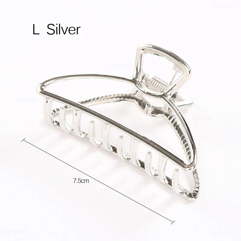 Geometric Metal Hair Claw Clip in silver, black and gold-tone metal finish, worn in hair - Varex HQ