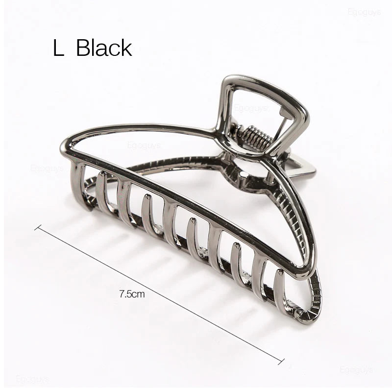 Geometric Metal Hair Claw Clip in silver, black and gold-tone metal finish, close-up detail - Varex HQ