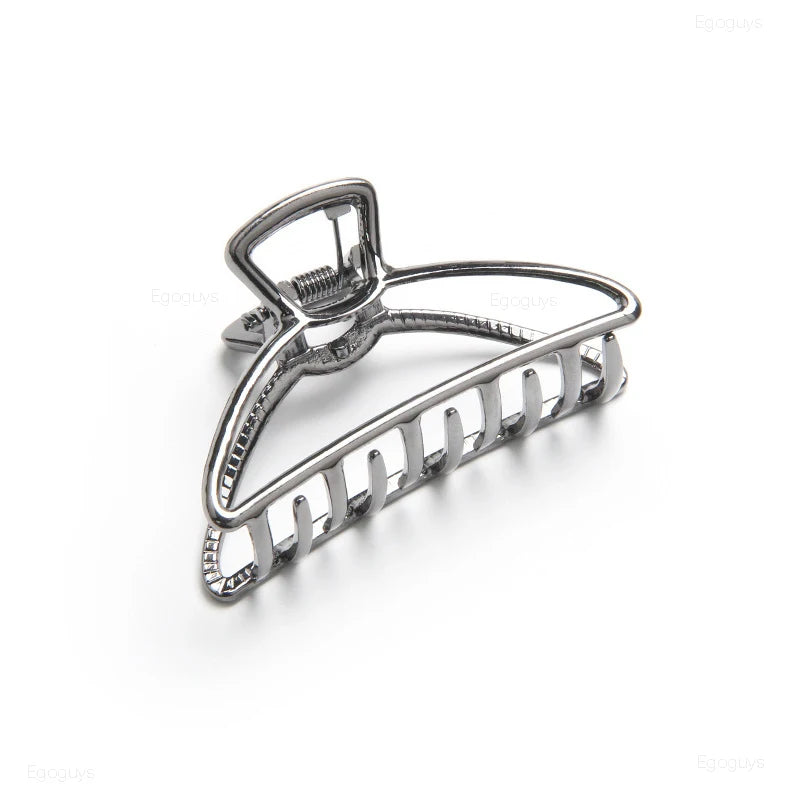 Geometric Metal Hair Claw Clip in silver, black and gold-tone metal finish, side profile - Varex HQ