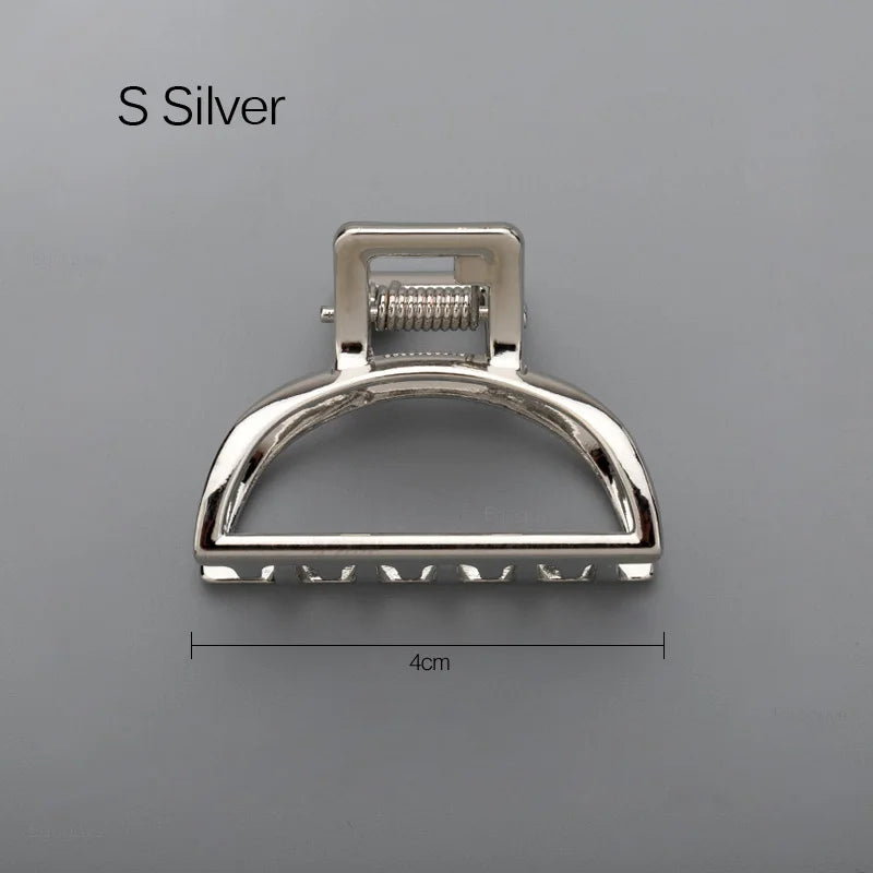 Geometric Metal Hair Claw Clip in silver, black and gold-tone metal finish, lifestyle shot - Varex HQ