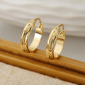 Glossy gold-plated geometric hoop earrings, styling angle 1 - Varex HQ
