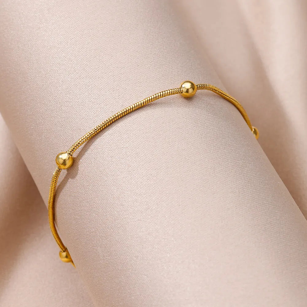 Beaded chain anklet worn on ankle, Varex HQ