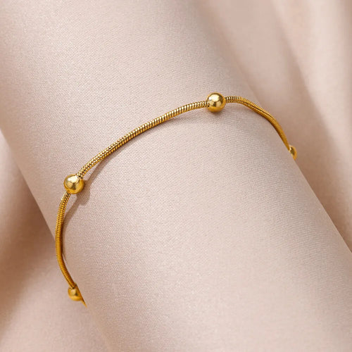 Beaded chain anklet worn on ankle, Varex HQ
