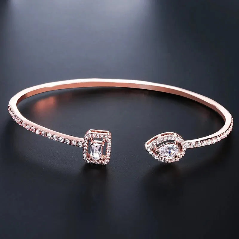 Gold geometric open cuff bangle with teardrop cubic zirconia, view 17 - Varex HQ
