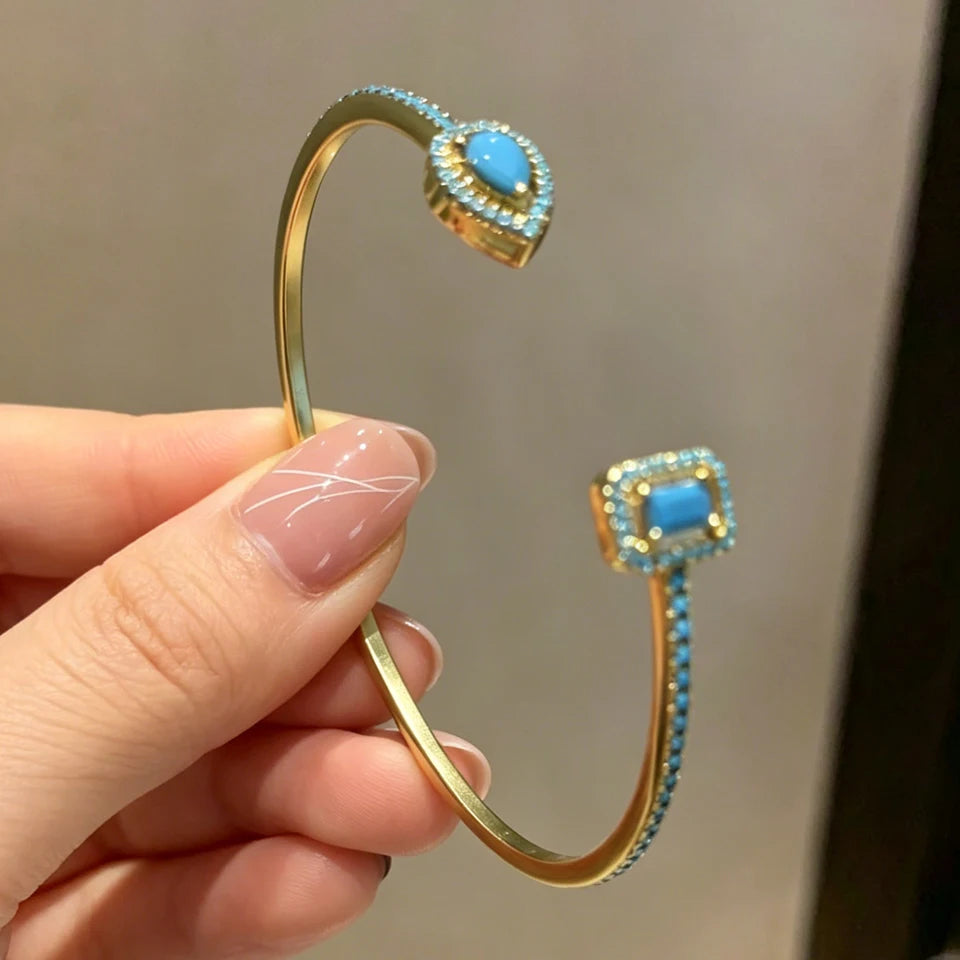 Gold geometric open cuff bangle with teardrop cubic zirconia, view 18 - Varex HQ