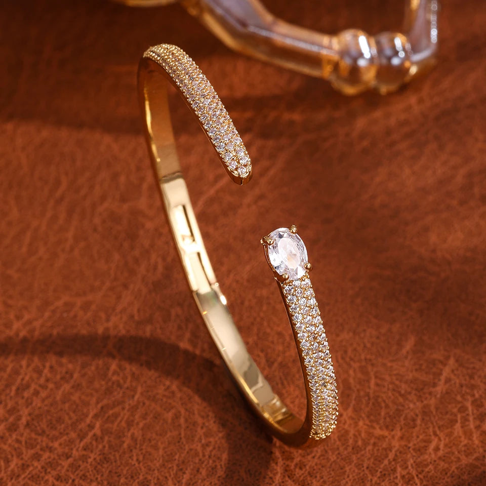 Gold geometric open cuff bangle with teardrop cubic zirconia, view 19 - Varex HQ