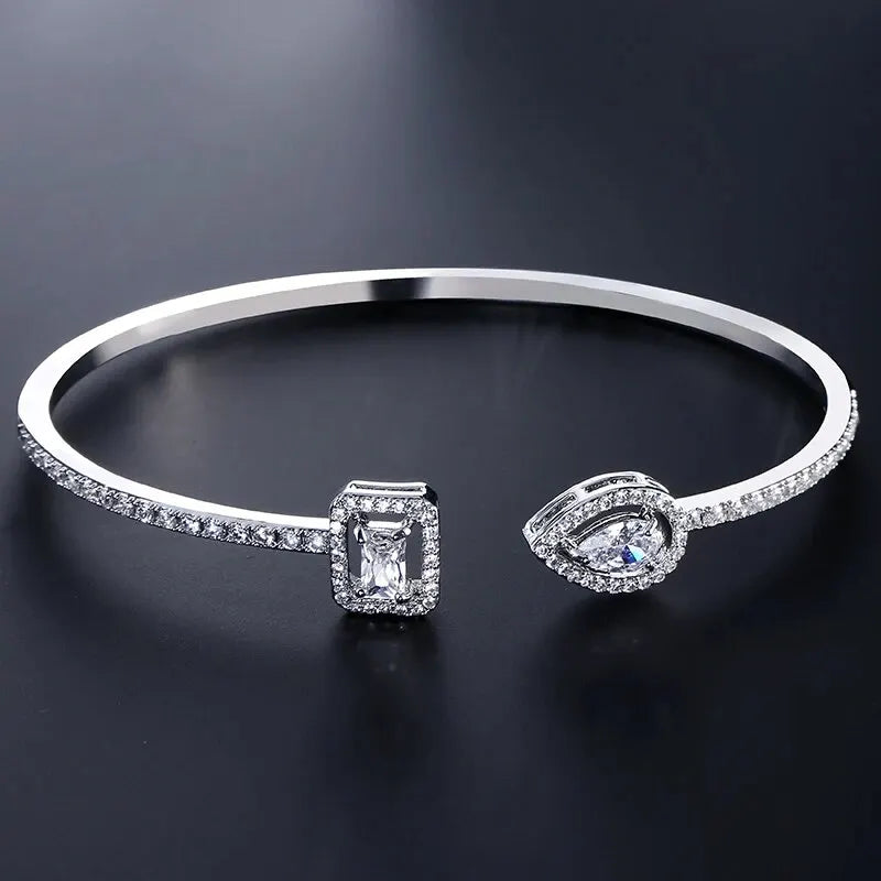 Gold geometric open cuff bangle with teardrop cubic zirconia, view 9 - Varex HQ