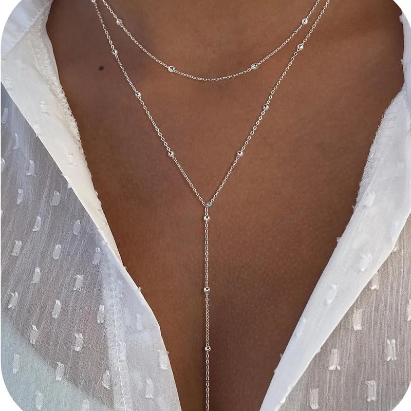 Gold-plated lariat necklace with double layered long chain drop - lifestyle shot - Varex HQ