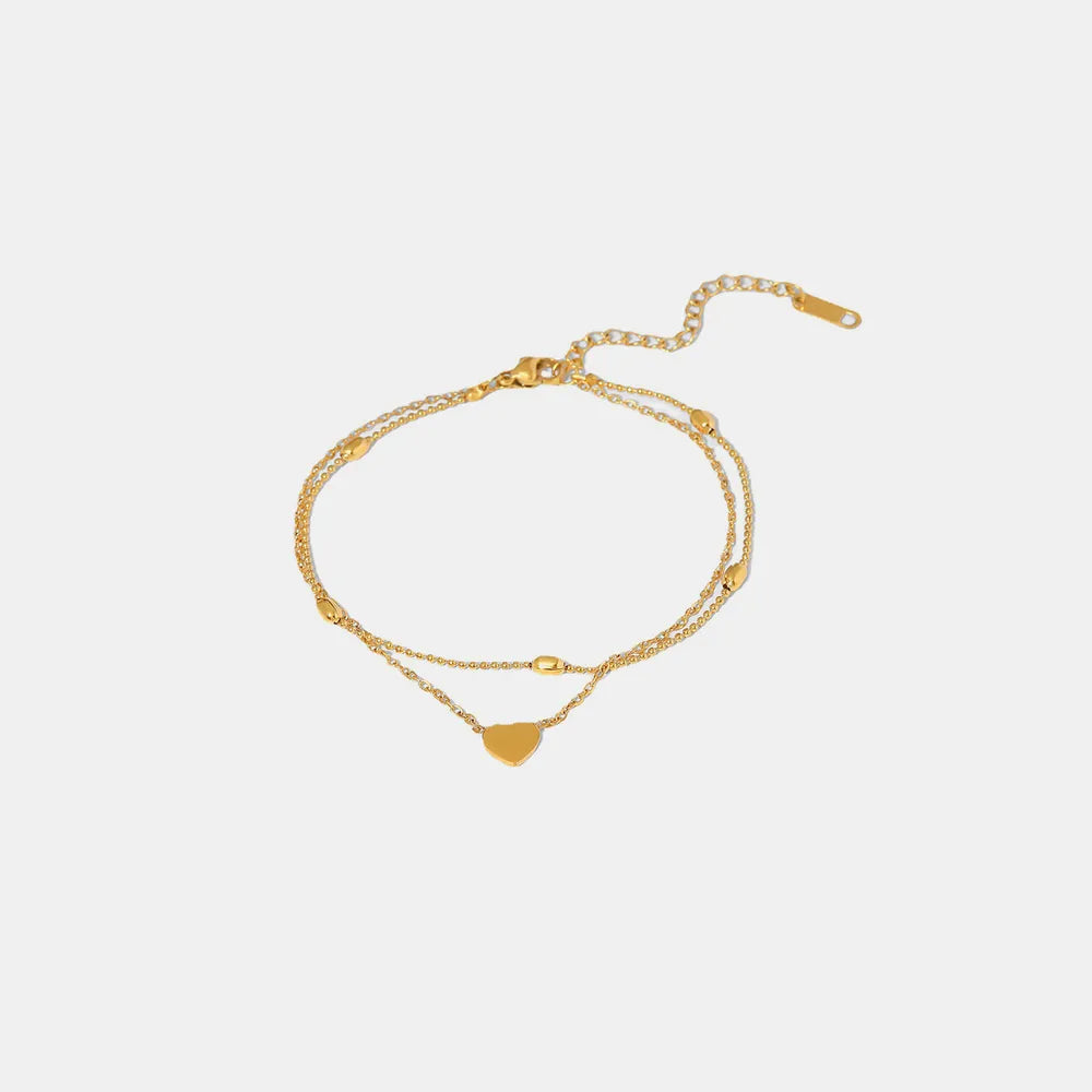 Gold-plated double layered heart anklet on clean white background