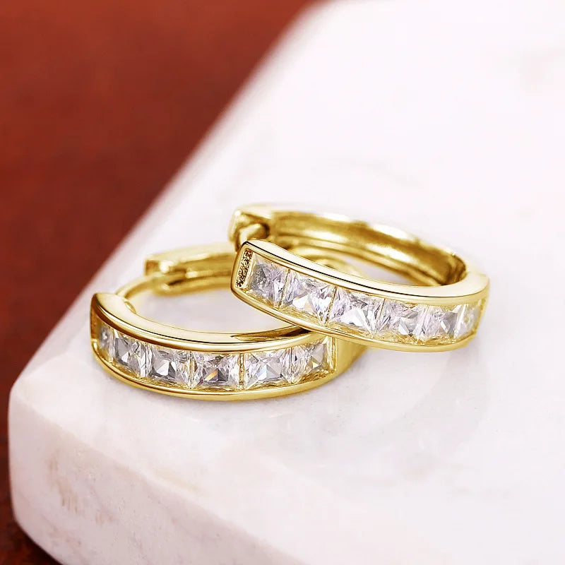 Gold-plated stainless steel round hoop earrings with cubic zirconia, detail view of cubic zirconia accent - Varex HQ