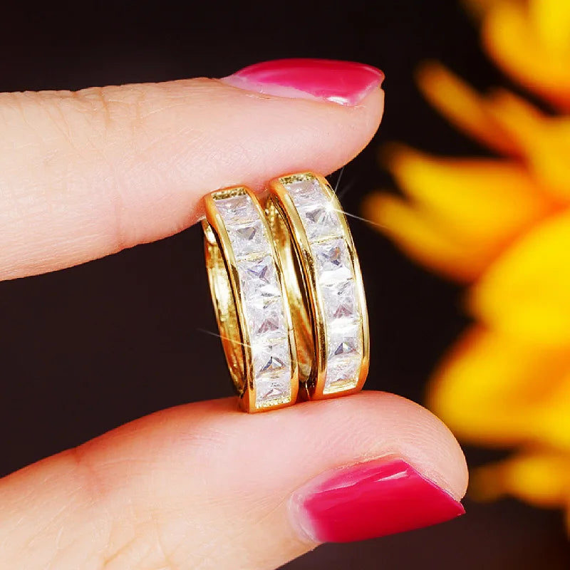Gold-plated stainless steel round hoop earrings with cubic zirconia, styling angle 1 - Varex HQ