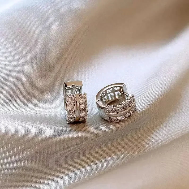 Gold-plated stainless steel round hoop earrings with cubic zirconia, styling angle 2 - Varex HQ