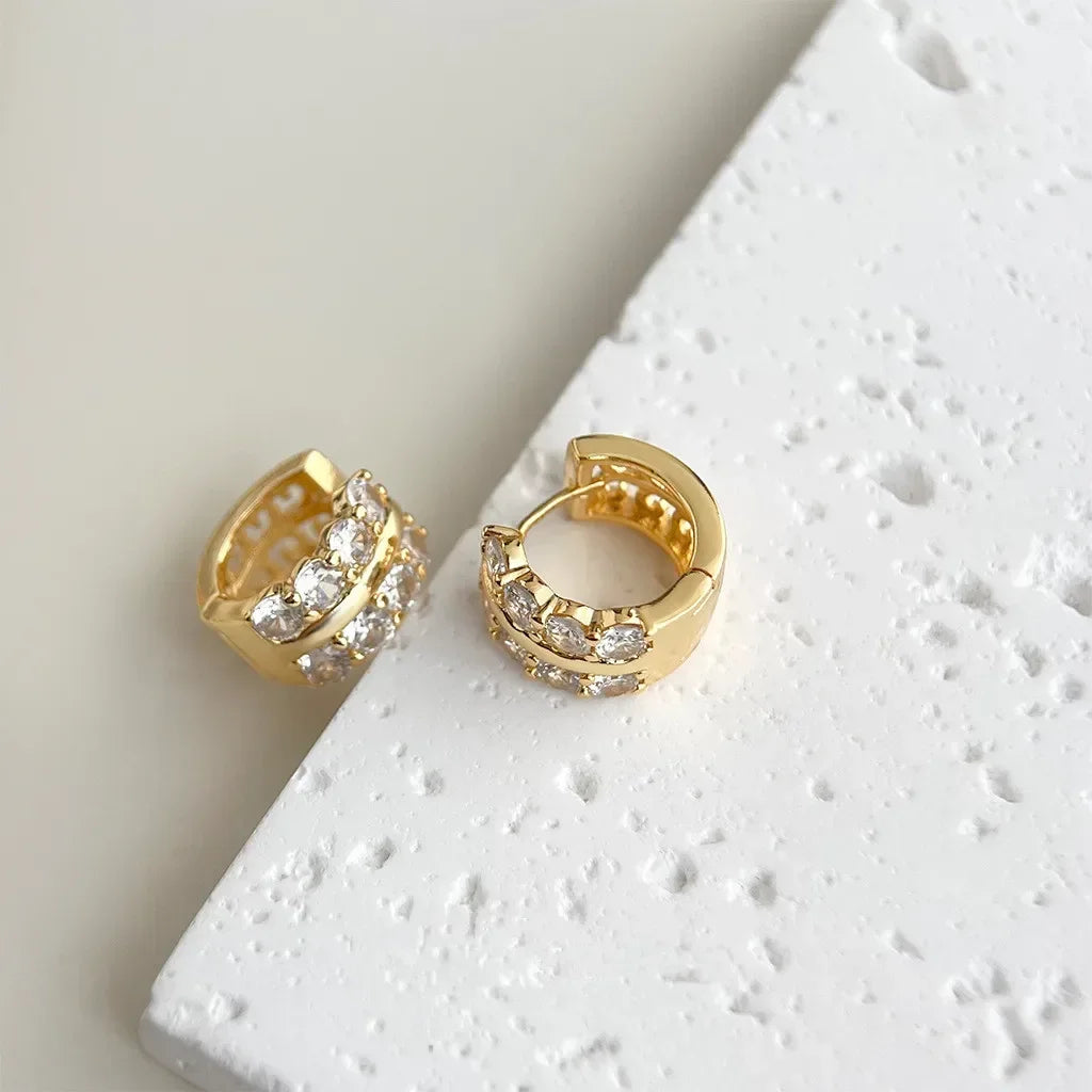 Gold-plated stainless steel round hoop earrings with cubic zirconia, styling angle 3 - Varex HQ