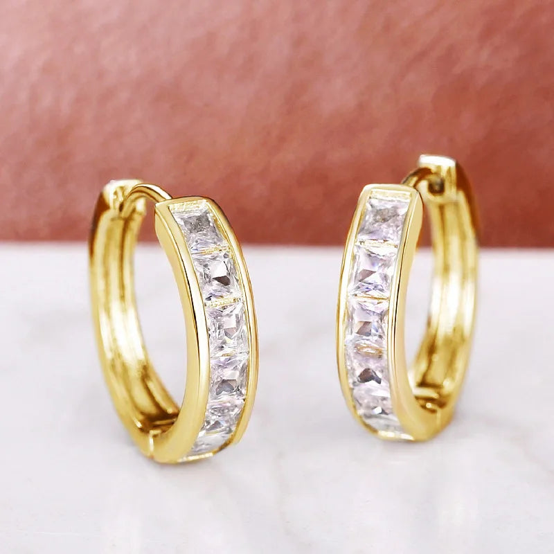 Gold-plated round hoop earrings styled on model, lifestyle shot - Varex HQ