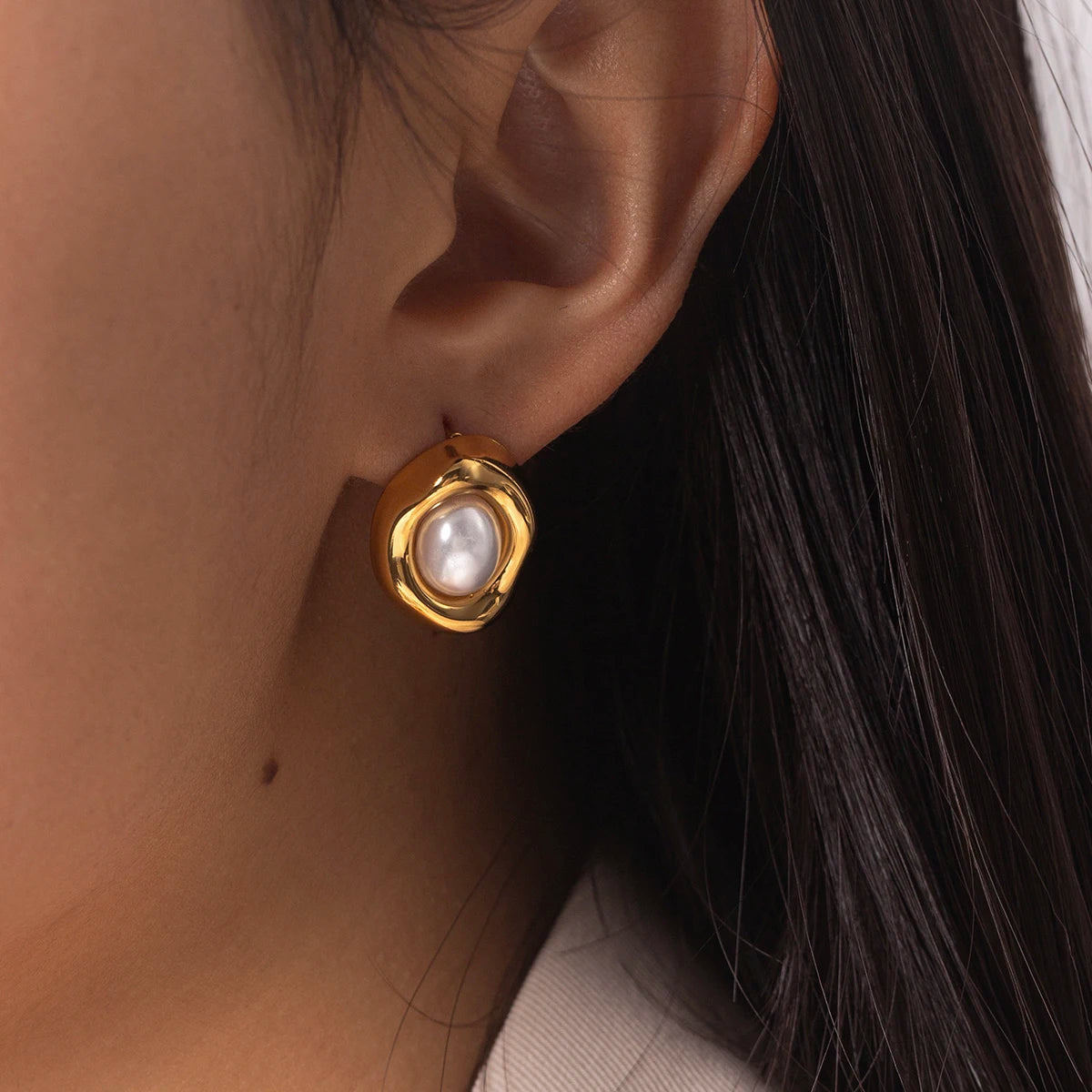 Gold-plated stud earrings with stone and faux-pearl accent, close detail view - Varex HQ