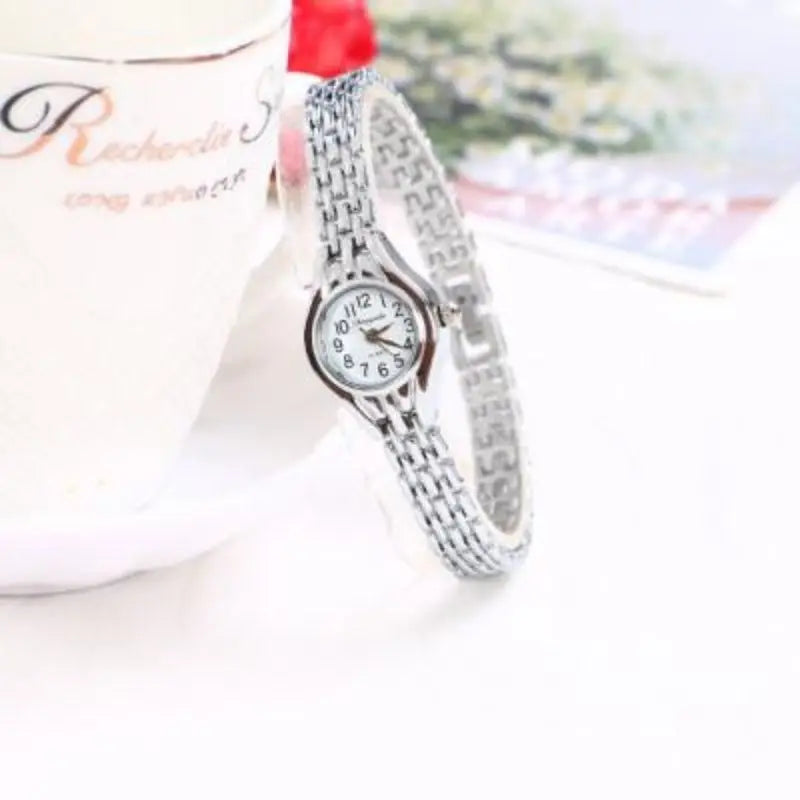 Gold-tone mesh bracelet watch, side profile