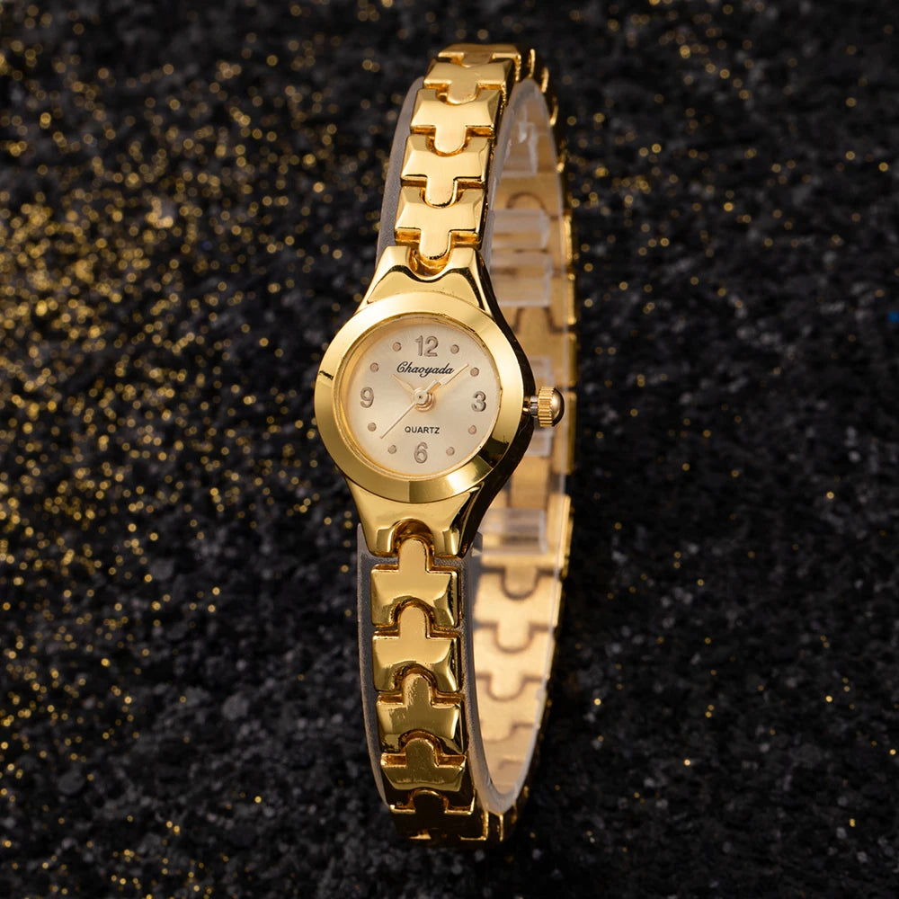 Gold-tone mesh bracelet watch, lifestyle shot on wrist
