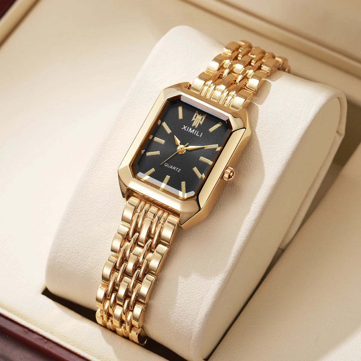 Gold-tone rectangle quartz watch worn on wrist