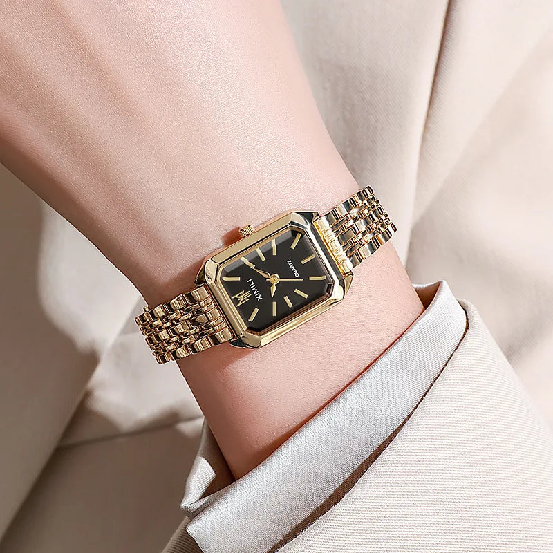 Gold-tone rectangle quartz watch, side profile on wrist