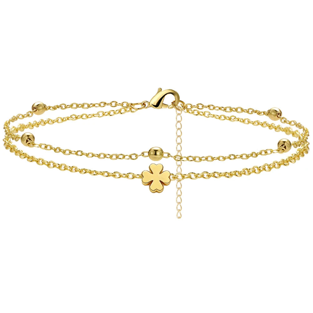 Heart charm layered anklet worn on model's ankle, Varex HQ