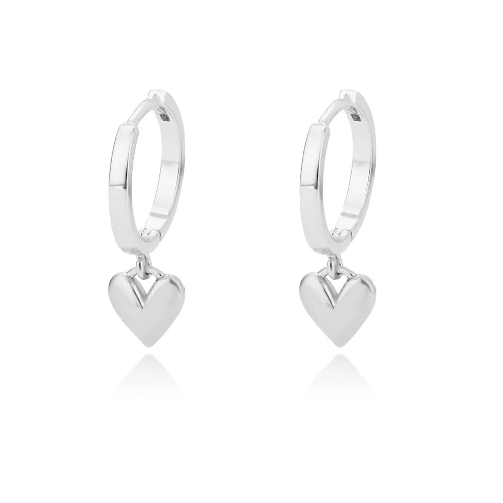 Heart hoop earrings in stainless steel with cubic zirconia heart accent, styling angle 6 - Varex HQ