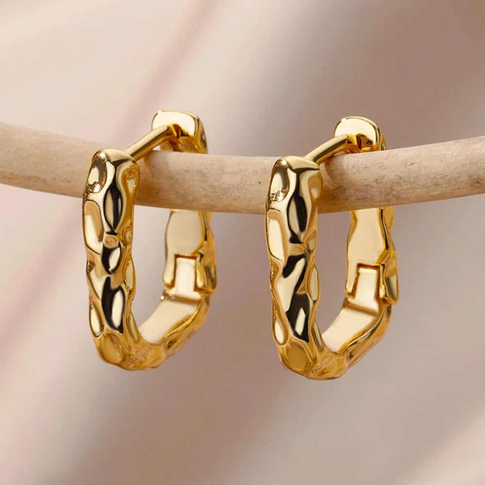 Heart hoop earrings in stainless steel with cubic zirconia heart accent, styling angle 7 - Varex HQ