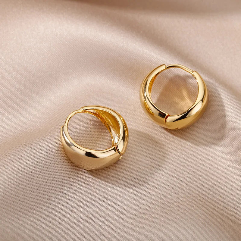 Heart hoop earrings in stainless steel with cubic zirconia heart accent, styling angle 8 - Varex HQ