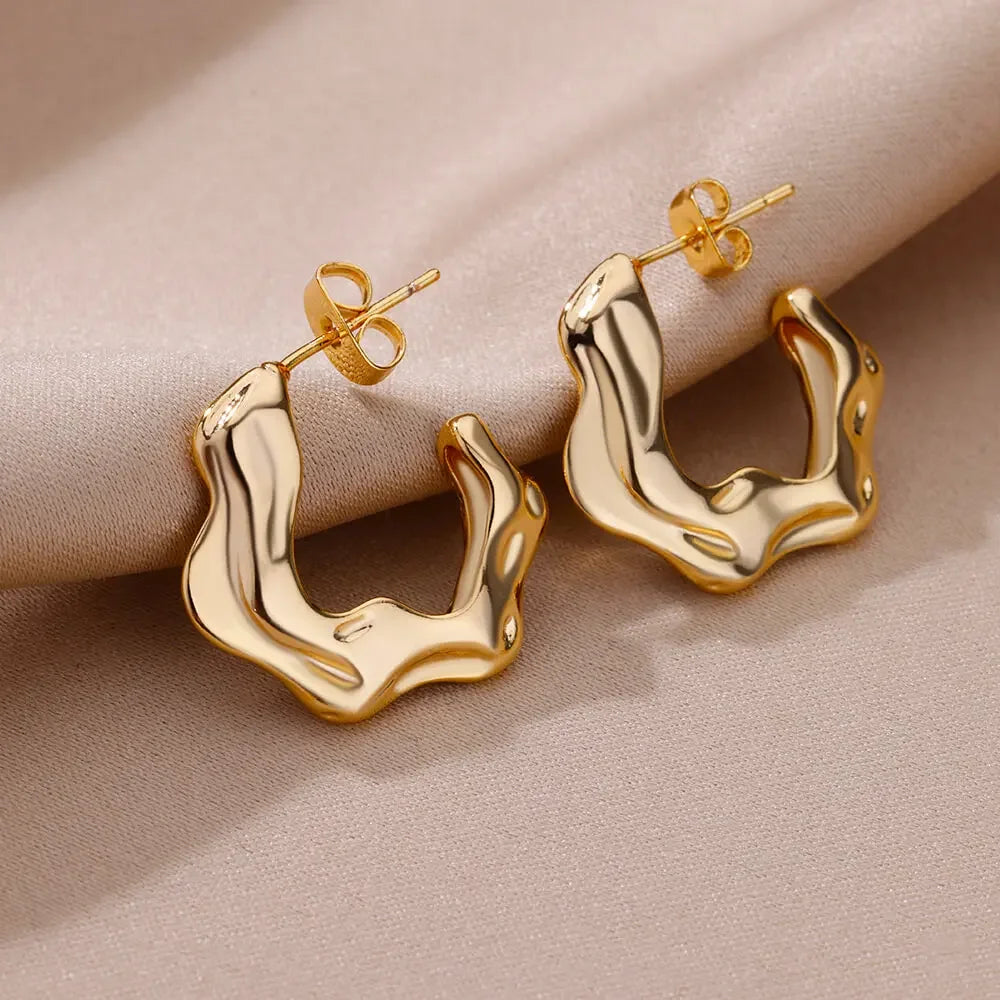 Heart hoop earrings in stainless steel with cubic zirconia heart accent, styling angle 9 - Varex HQ