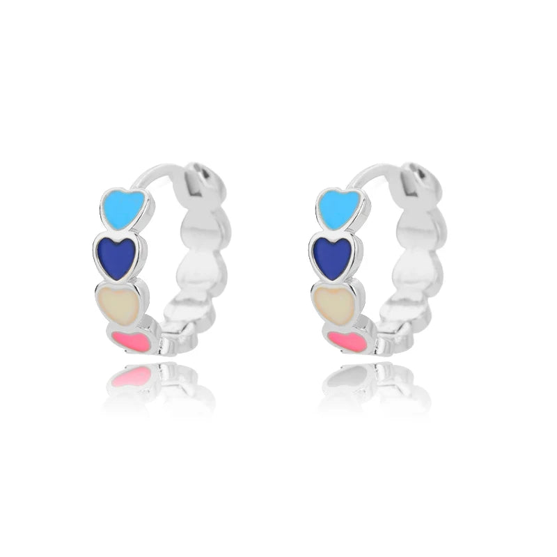 Heart hoop earrings in stainless steel with cubic zirconia heart accent, styling angle 10 - Varex HQ